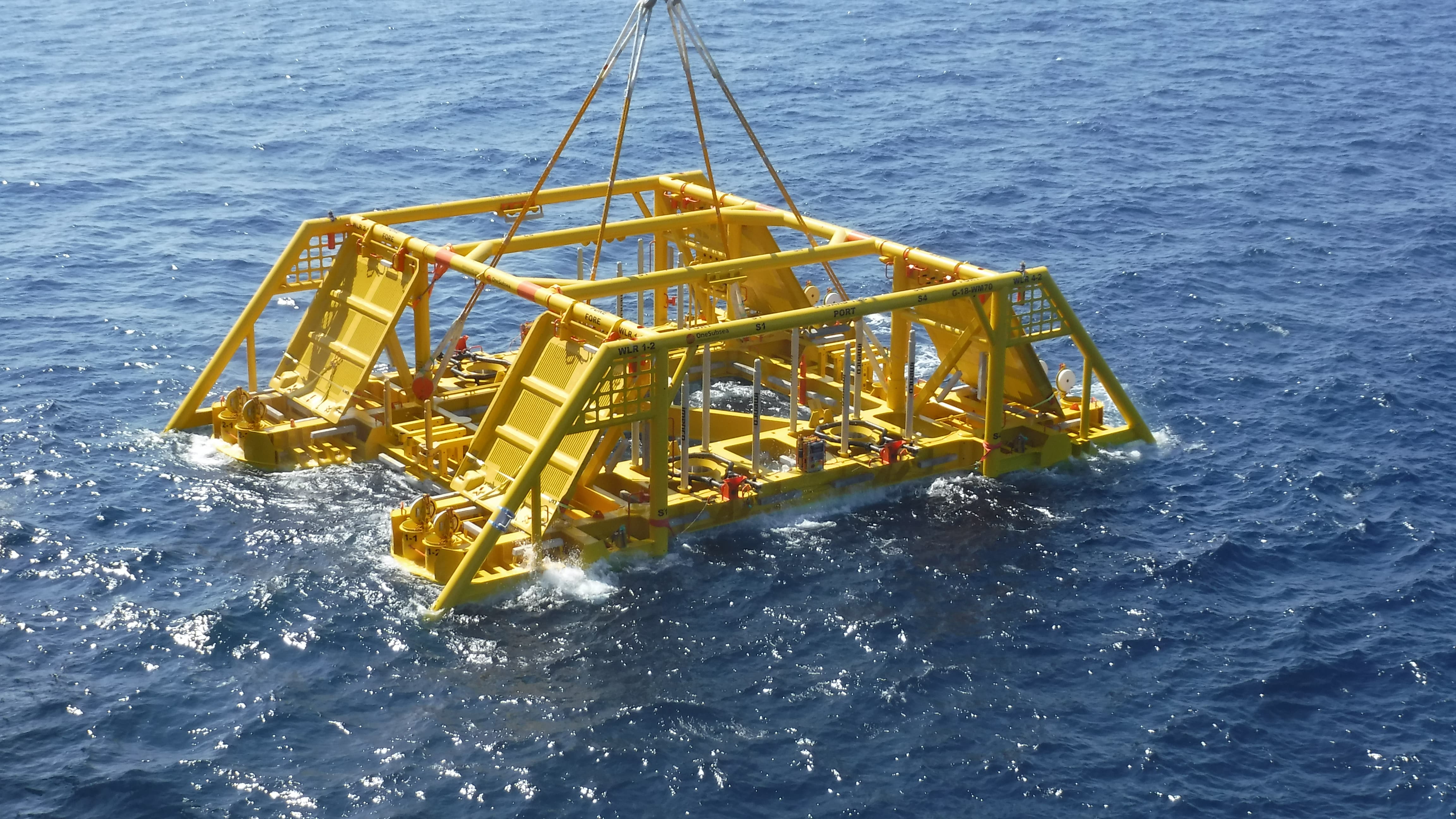 Subsea template being deployed min